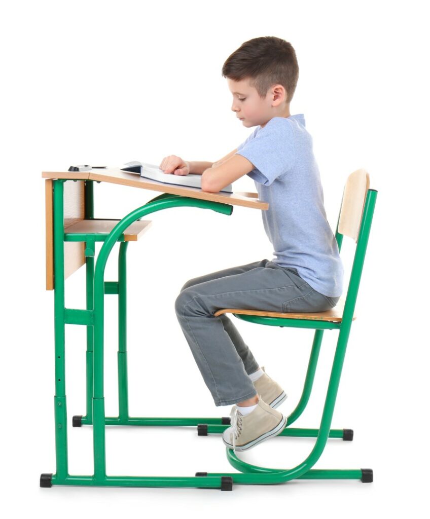 Incorrect,Posture,Concept.,Schoolboy,Sitting,At,Desk,On,White,Background